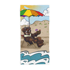 A beach towel featuring a cartoon adventure ted bear with sunglasses and a colorful umbrella, set against a beach and ocean backdrop.