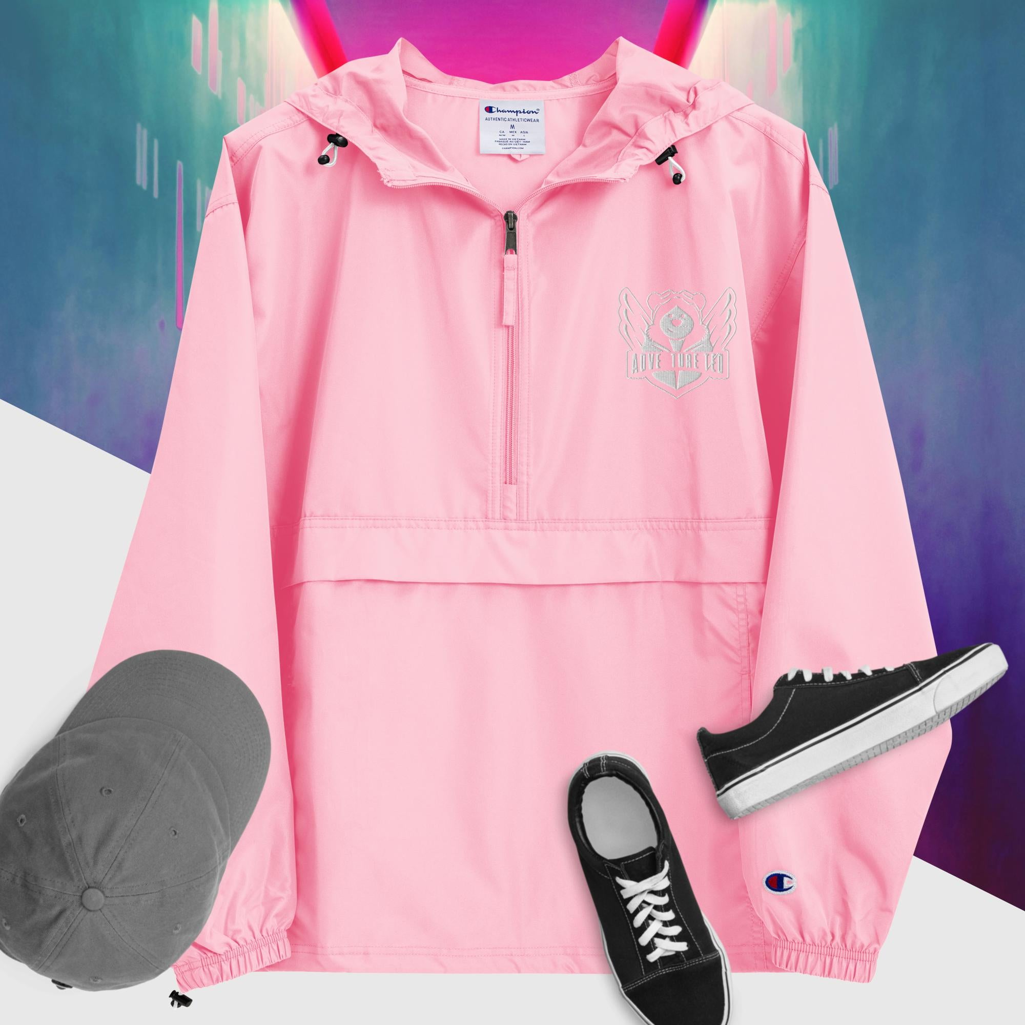 A pink candy packable jacket with embroidered 'C' logo on the left sleeve, a hood, front kangaroo pocket, and a zipped pouch pocket. It is displayed alongside a grey hat and black sneakers.
