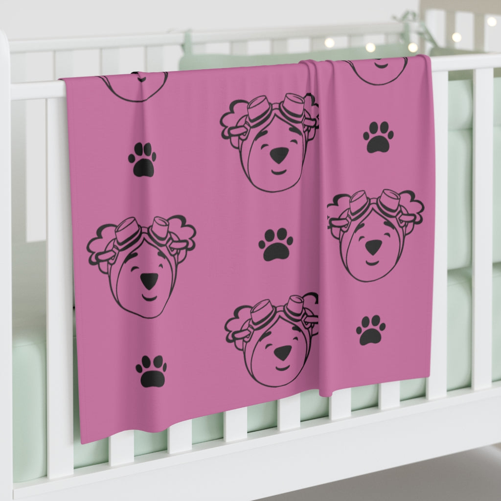 Jersey polyester blanket with paw prints and adventure ted outline. 30 inches by 40 inches (76.2cm × 101.6cm)